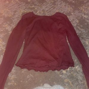 A plum color long sleeve shirt.
